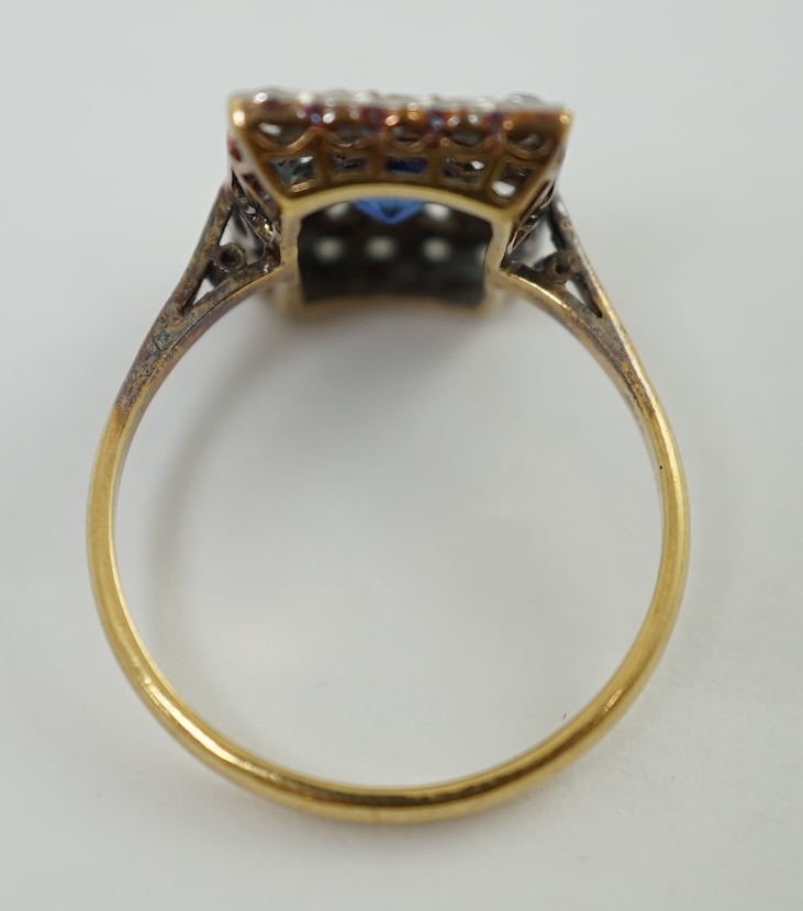 An early 20th century 18ct and platinum, millegrain set sapphire and diamond cluster tablet ring